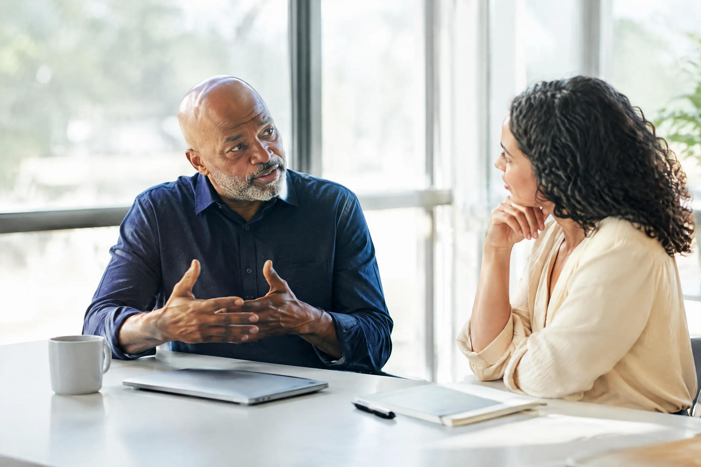Two professionals in a focused conversation
